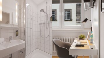 Habitación Business individual | Baño | Ducha, artículos de higiene personal gratuitos y secador de pelo