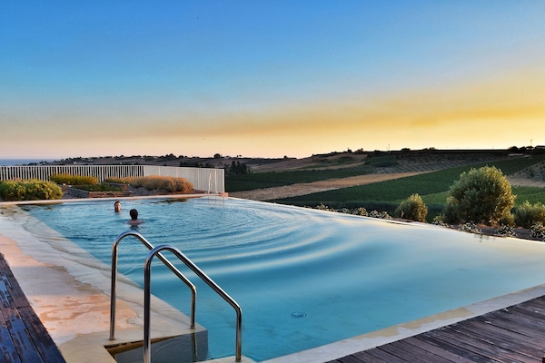 Outdoor pool, pool umbrellas, sun loungers