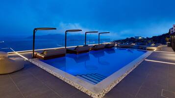 Seasonal outdoor pool, pool umbrellas, pool loungers
