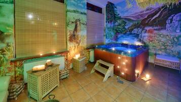 Relax in a serene spa room with a hot tub, surrounded by a rustic ambiance and a soothing forest mural.