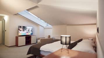 A modern hotel room with a skylight, a television, a bed, a desk, and a chair.