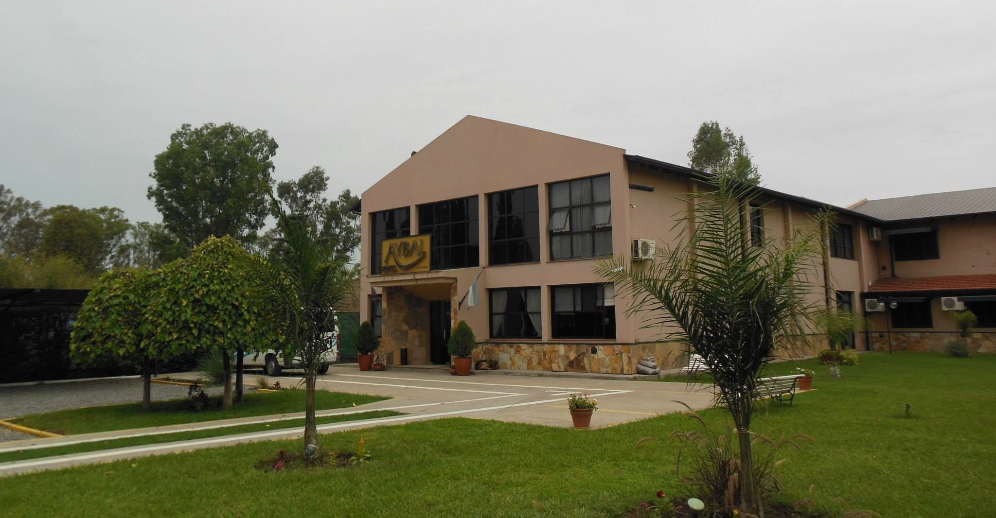 A building with a sign that reads "Hotel".