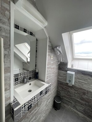 Desk, iron/ironing board, bed sheets