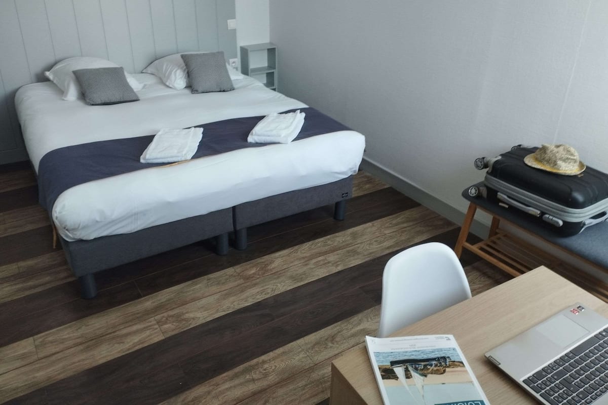 Family Room | Desk, iron/ironing board, bed sheets