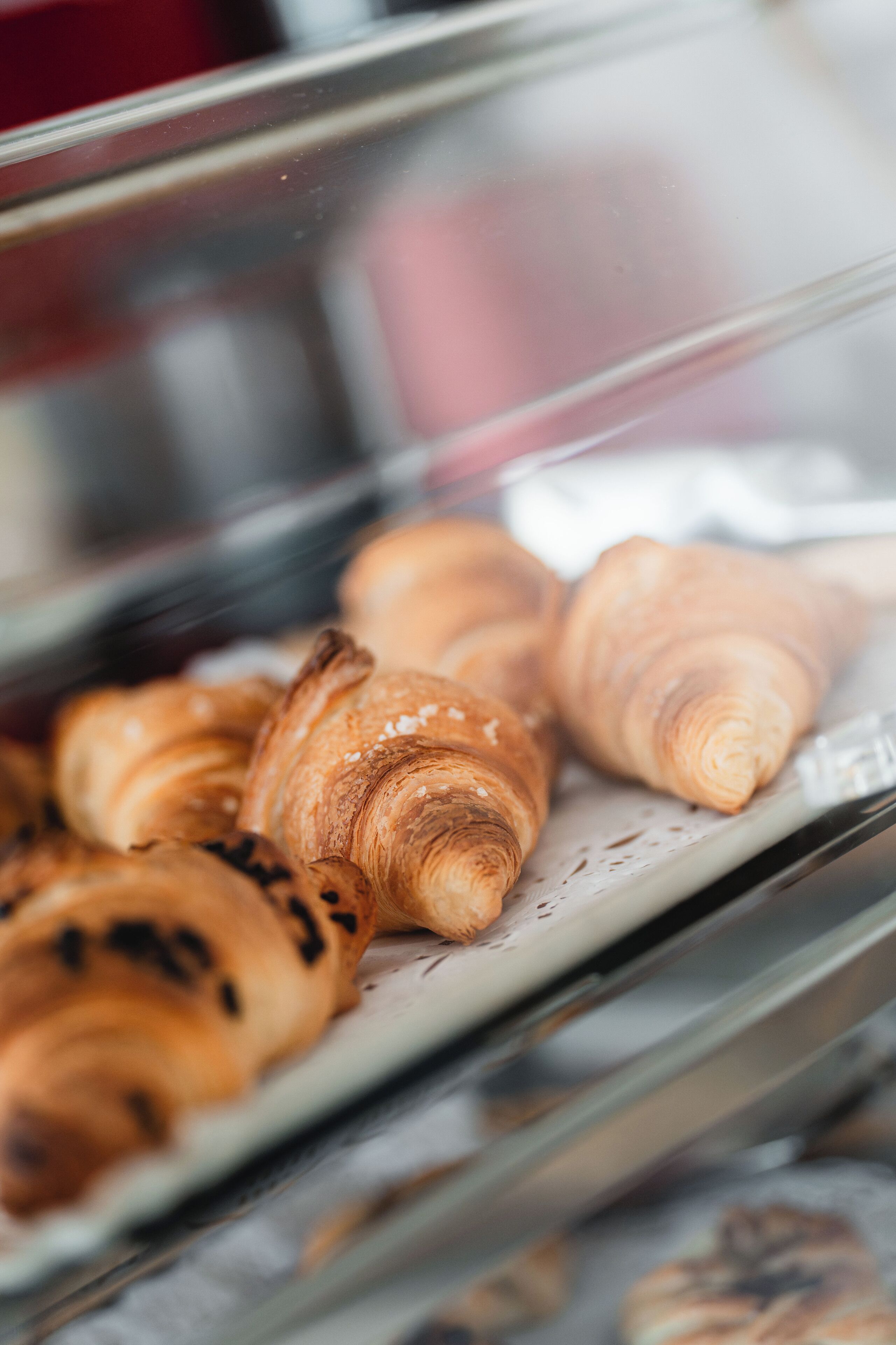 A display case with croissants.