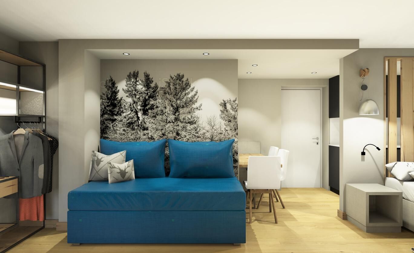 Een moderne woonkamer met een blauwe bank, een eethoek en een kast met daarin hangende kleding.
