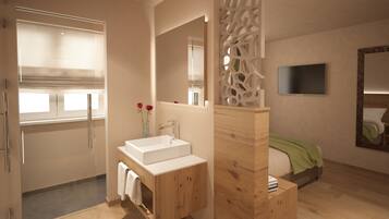 Une salle de bain moderne avec un grand miroir, un meuble-lavabo en bois et un espace douche.