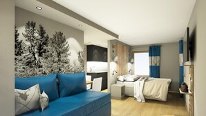 A modern hotel room with a blue sofa, a bed, a desk, and a TV. - Al Sole Mountain Chic (Folgaria)