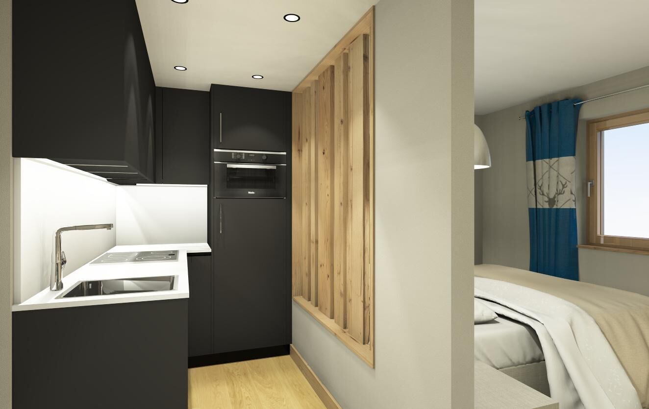 Una cocina compacta con electrodomésticos modernos, horno integrado y un lavabo blanco.
