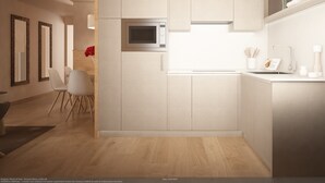 A modern kitchen with a built-in microwave, a sink, and a dining area with chairs. - Al Sole Mountain Chic (Folgaria)
