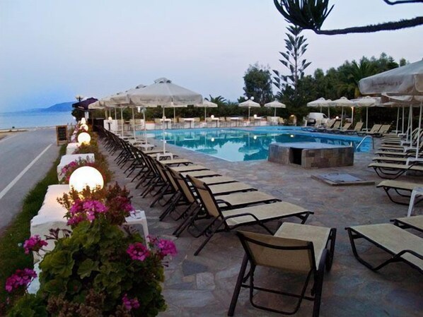Outdoor pool, open 8:00 AM to 10:00 PM, pool umbrellas