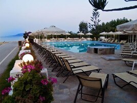 Outdoor pool, open 8:00 AM to 10:00 PM, pool umbrellas