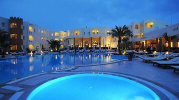 Indoor pool, outdoor pool, pool umbrellas, pool loungers