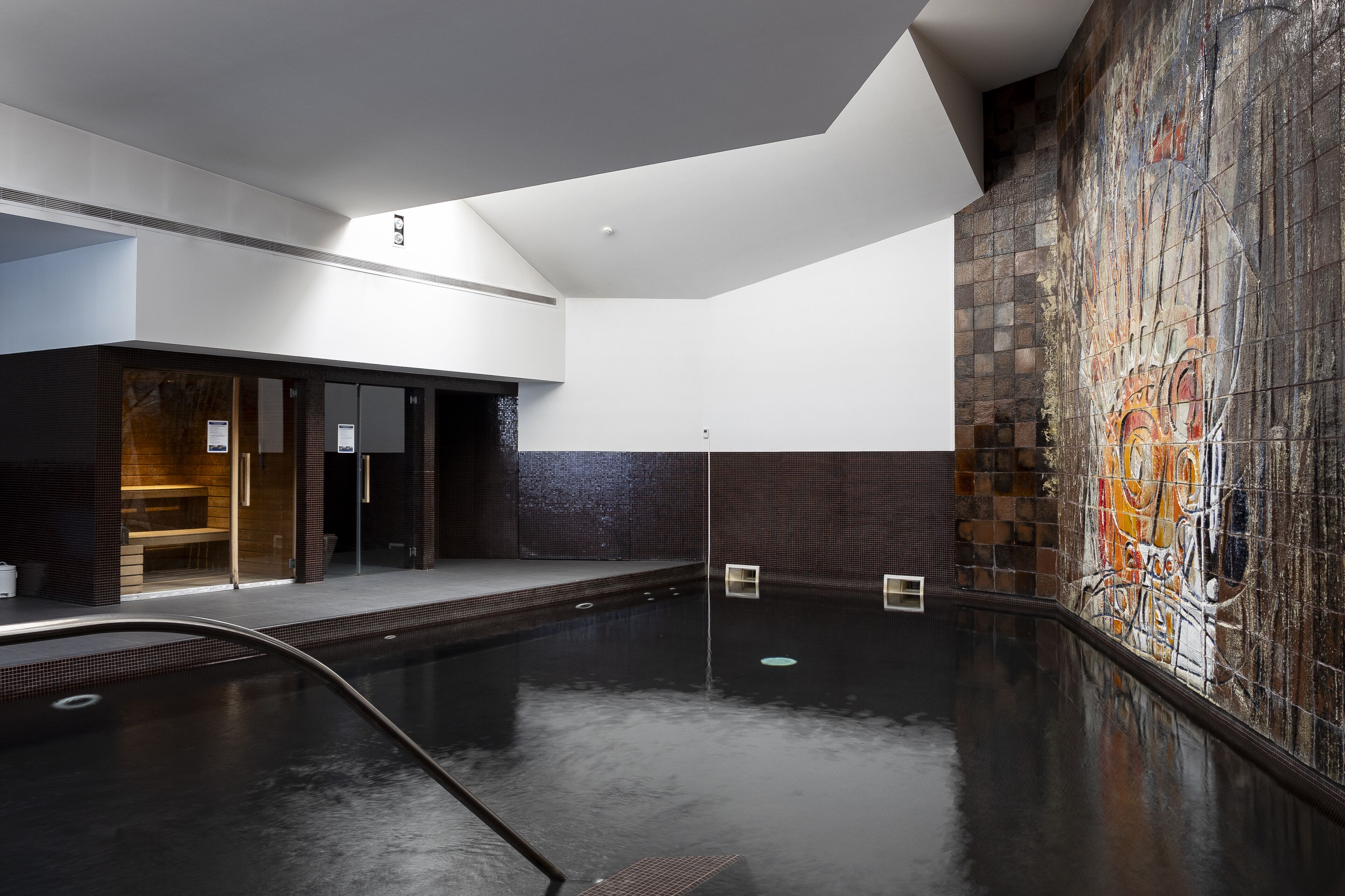 Indoor pool, open 8:00 AM to 8 PM, pool loungers