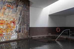 Indoor pool, open 8:00 AM to 8 PM, pool loungers
