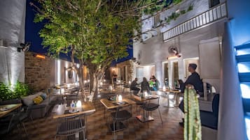 Dinner served, Greek cuisine, garden views