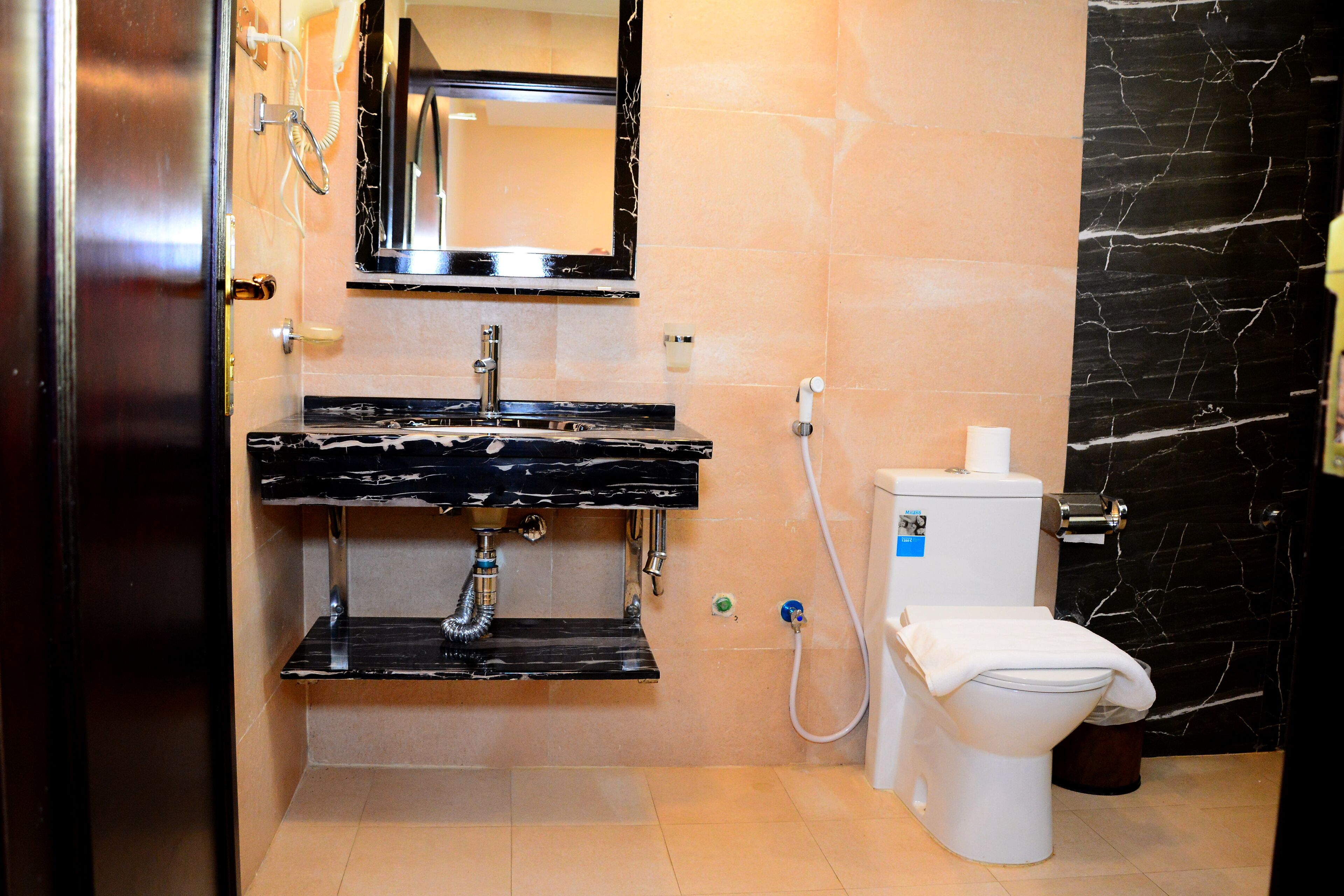 deluxe suite | bathroom | free toiletries, slippers, towels