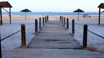 Private beach, sun-loungers, beach umbrellas, beach bar