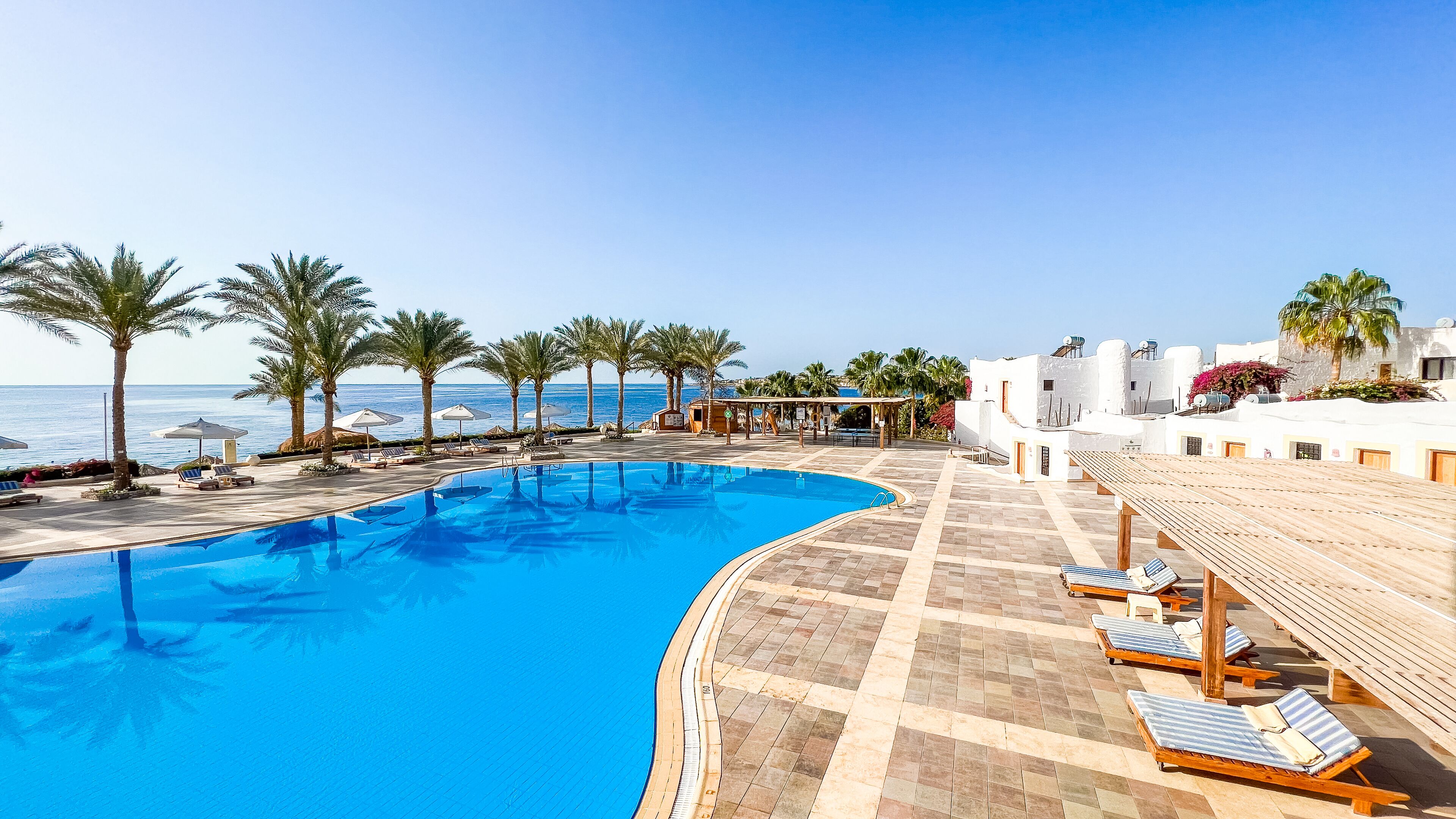 indoor pool, 2 outdoor pools, pool umbrellas, lifeguards on site