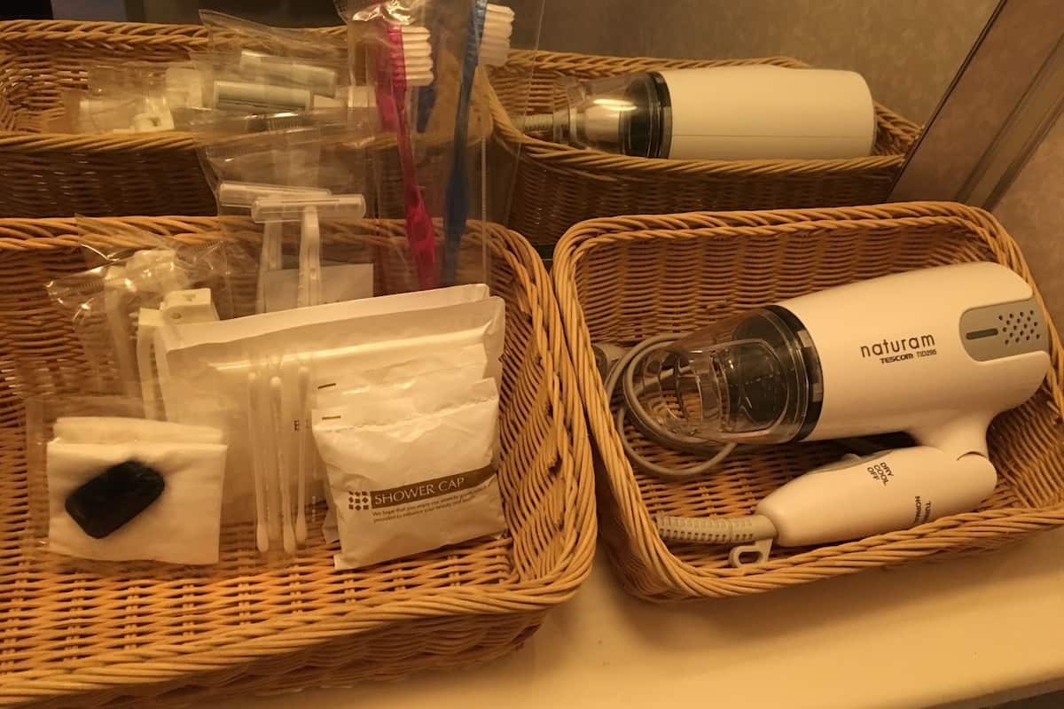 bathtub, free toiletries, hair dryer, slippers