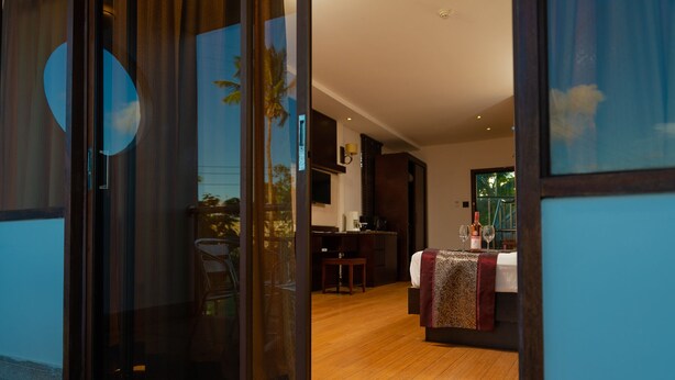 A modern interior with a dining area, a kitchen, and a living space. - Herdmanston Lodge (Georgetown)
