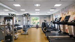 A gym with treadmills, weight machines, and dumbbells. - Hyatt Place Raleigh/Cary (Raleigh)
