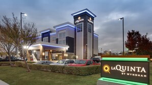 A hotel with a modern design, featuring a prominent 'La Quinta by Wyndham' sign.