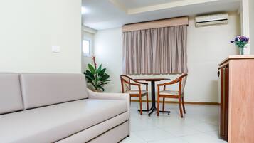 Suite | Living room | 32-inch TV with cable channels, toys