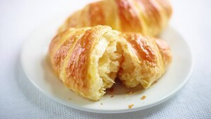A croissant on a white plate. - Holiday Inn Express Manchester City Centre Arena by IHG (Manchester)