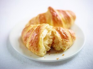 A croissant on a white plate. - Holiday Inn Express Manchester City Centre Arena by IHG (Manchester)