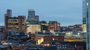 A cityscape with various buildings, including a mix of modern and older architecture.