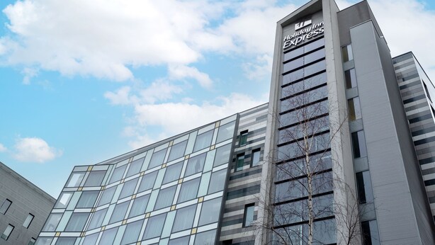 A modern hotel building with a prominent sign for Holiday Inn Express. - Holiday Inn Express Manchester City Centre Arena by IHG (Manchester)