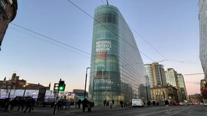 A modern glass building with signage for the National Football Museum and Drama Theatre. - Holiday Inn Express Manchester City Centre Arena by IHG (Manchester)
