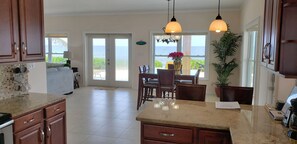 Luxury Villa, 3 Bedrooms, Pool Access, Beachfront | Private kitchen | Full-sized fridge, microwave, oven, stovetop - Cayman Luxury Rentals at Ocean Paradise (North Side)