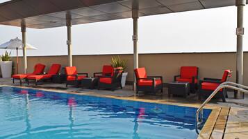 Outdoor pool, open 7:00 AM to 10:00 PM, pool umbrellas, sun loungers