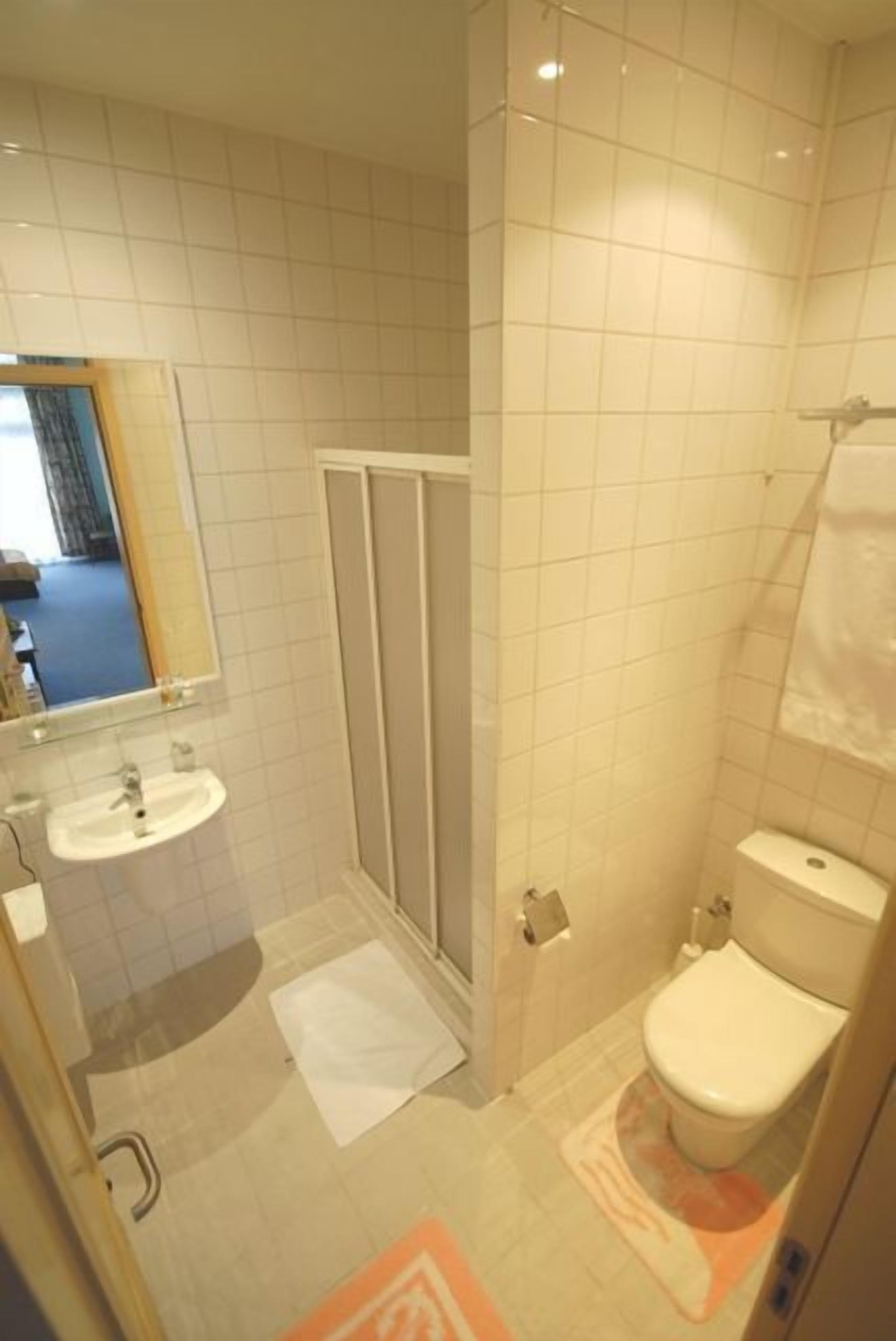 Shower, free toiletries, hair dryer, slippers