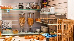 A breakfast buffet with various food items and utensils. - Le 21 Hotel (Saint-Raphael)