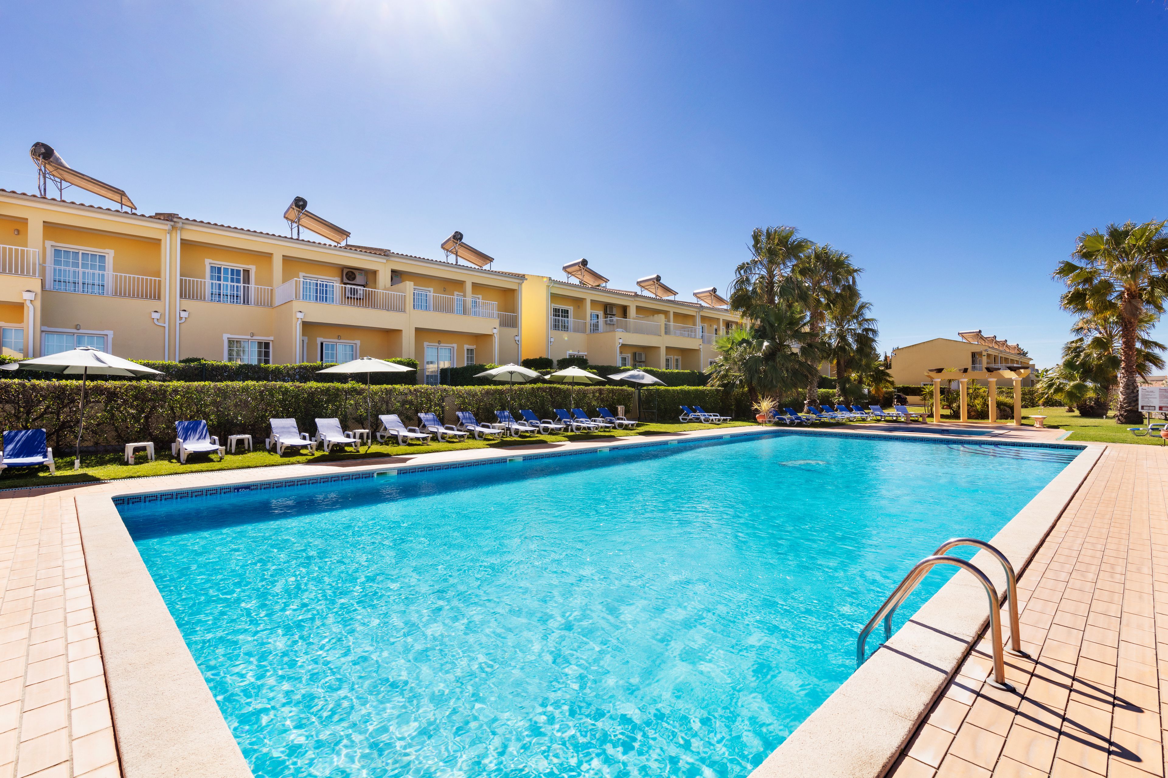 Seasonal outdoor pool, pool umbrellas