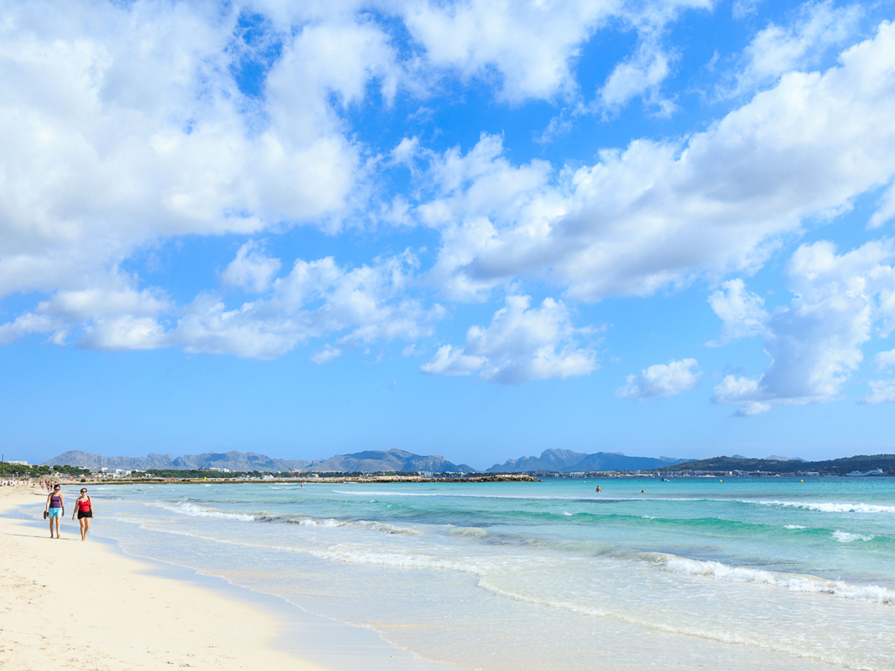 A beach with clear skies and calm waters.