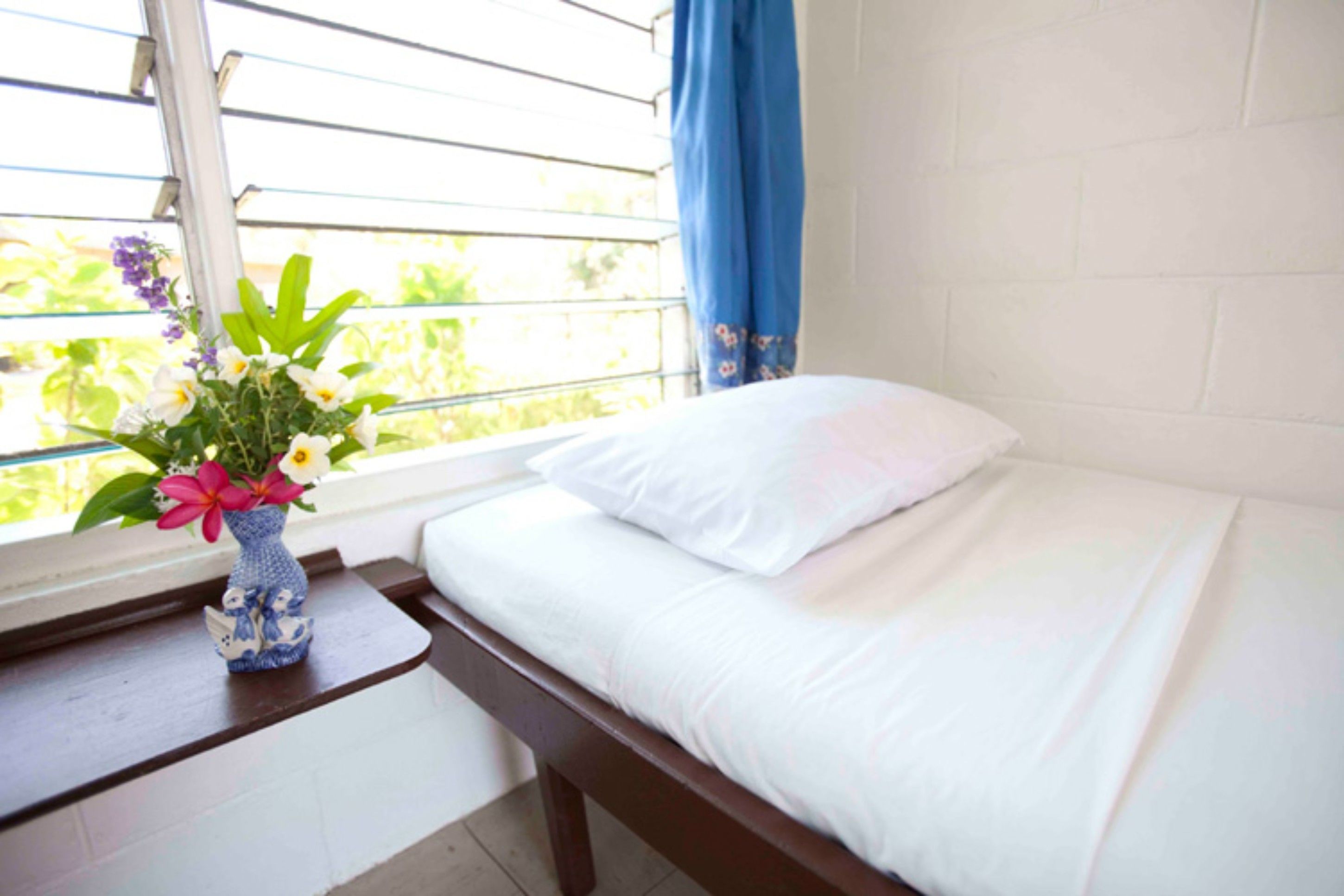 economy room, 2 single beds, courtyard area | in-room safe, individually furnished, laptop workspace