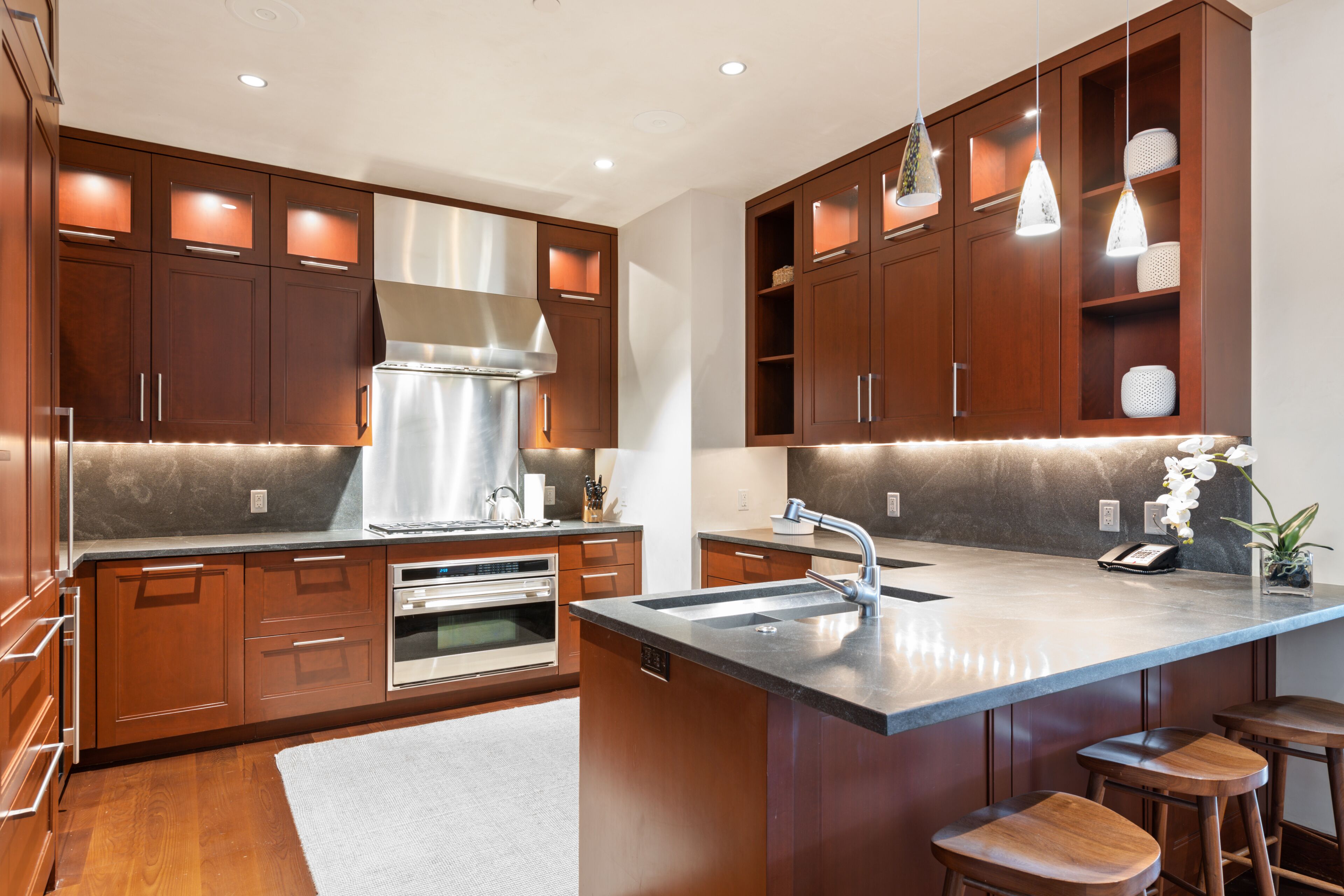 two bedroom plus den standard residence | private kitchen | full-sized fridge, microwave, oven, stovetop