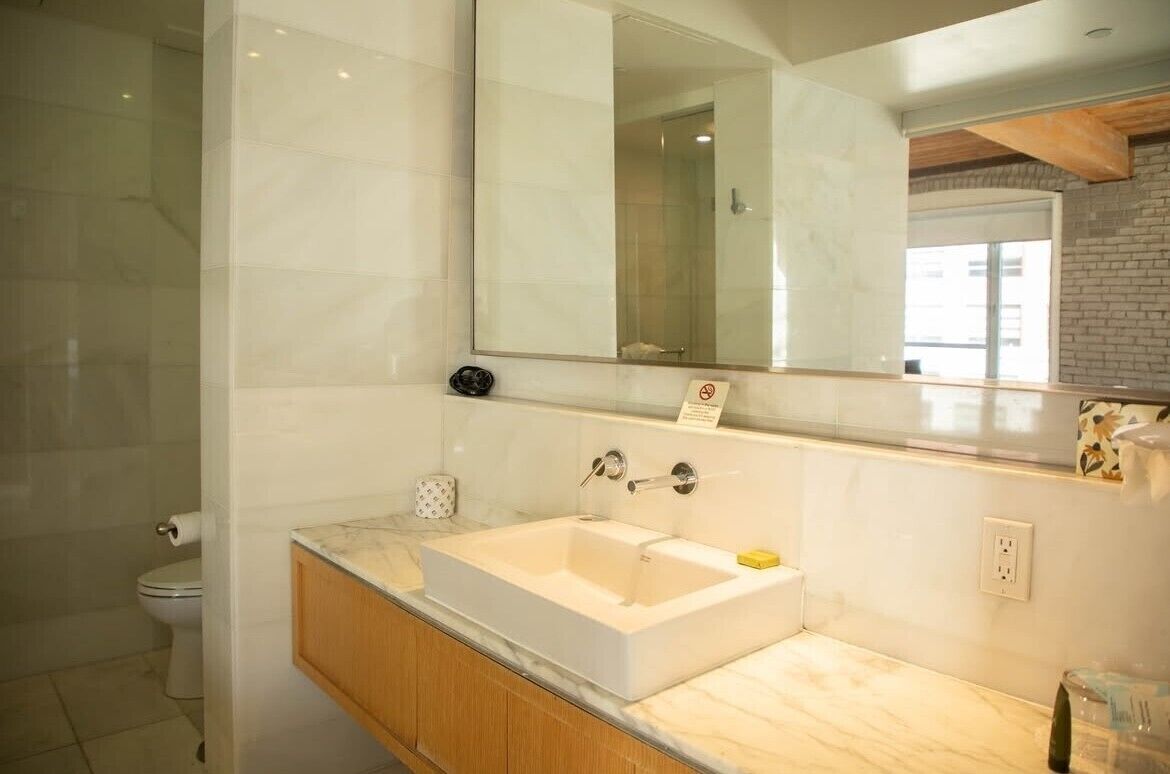 deluxe room, 1 king bed | bathroom | shower, hair dryer, towels