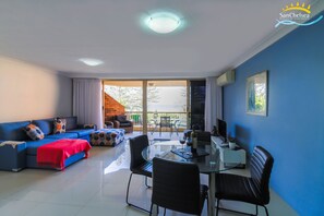 1 Bed Seaview Deluxe 2 Nights | Living room | 81-cm flat-screen TV with cable channels, TV