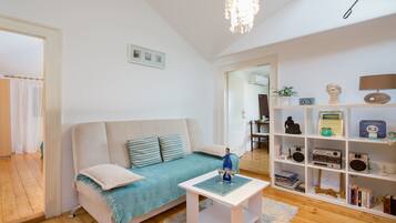 City Apartment, 3 Bedrooms, Kitchen | Living area | TV