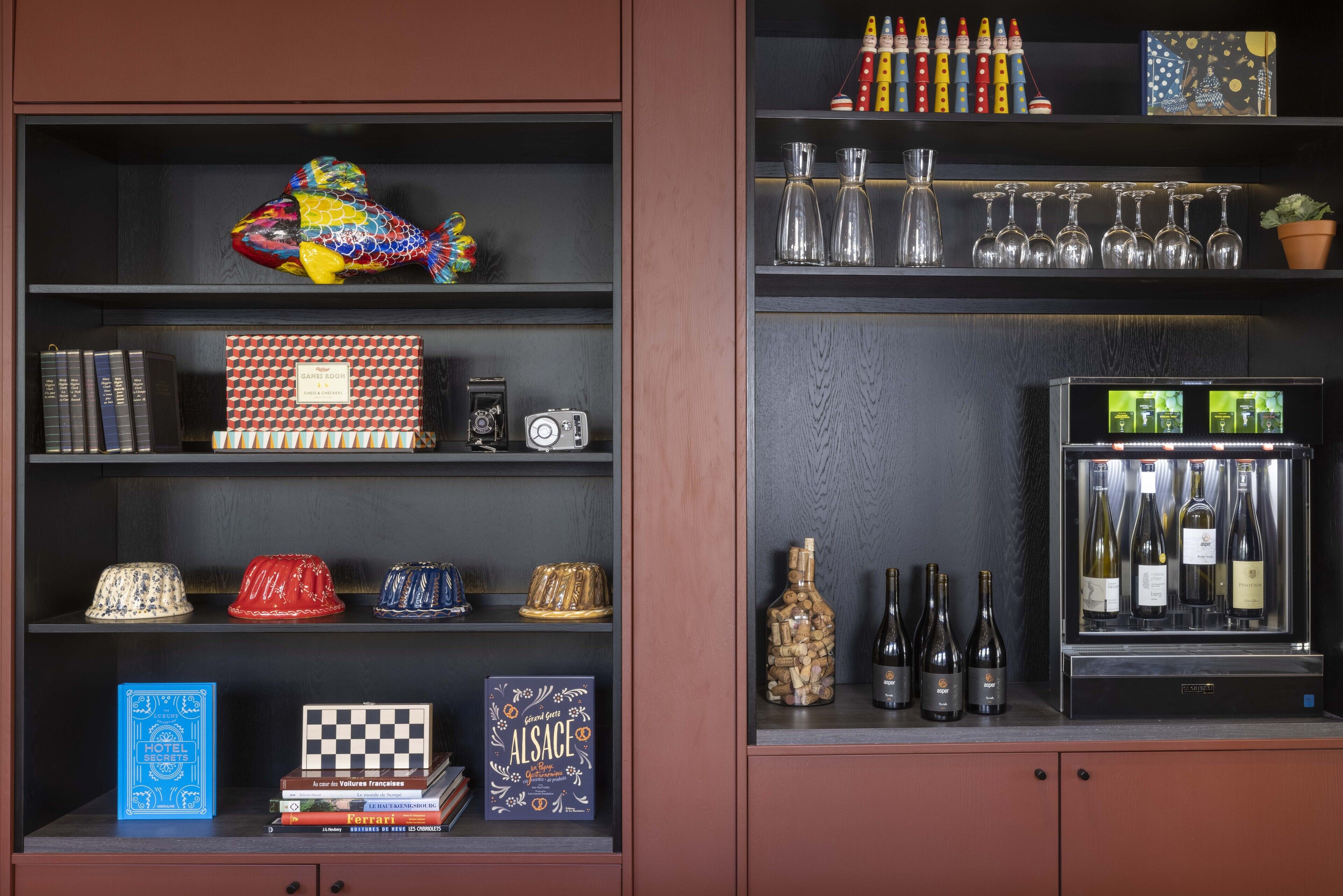 A shelf with books, a camera, and decorative items.