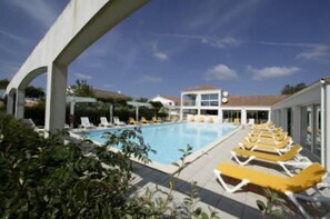 2 outdoor pools, open 9:00 AM to 8:00 PM, pool loungers