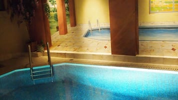 Indoor pool, open 8:00 AM to 9:00 PM, pool loungers