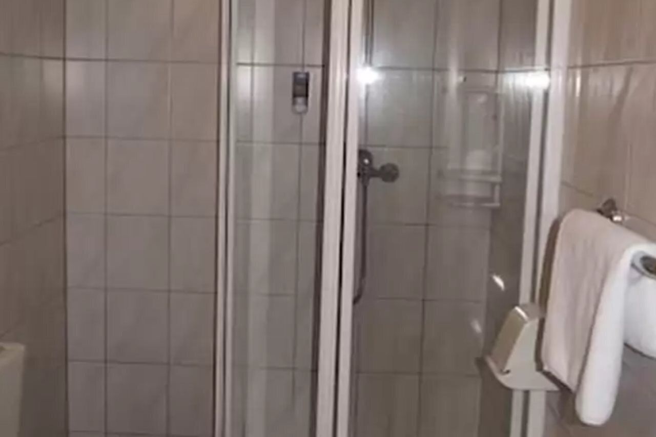 Shower, rainfall showerhead, towels