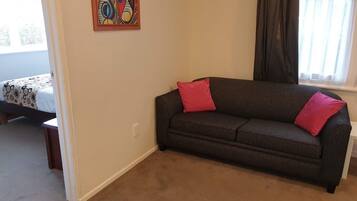 Room, 1 Bedroom | Desk, blackout drapes, iron/ironing board, free WiFi