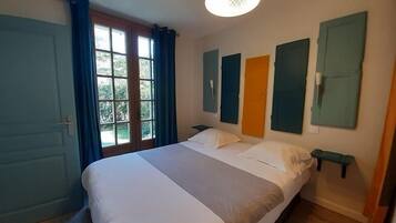 Family Room | Premium bedding, individually decorated, desk, blackout drapes